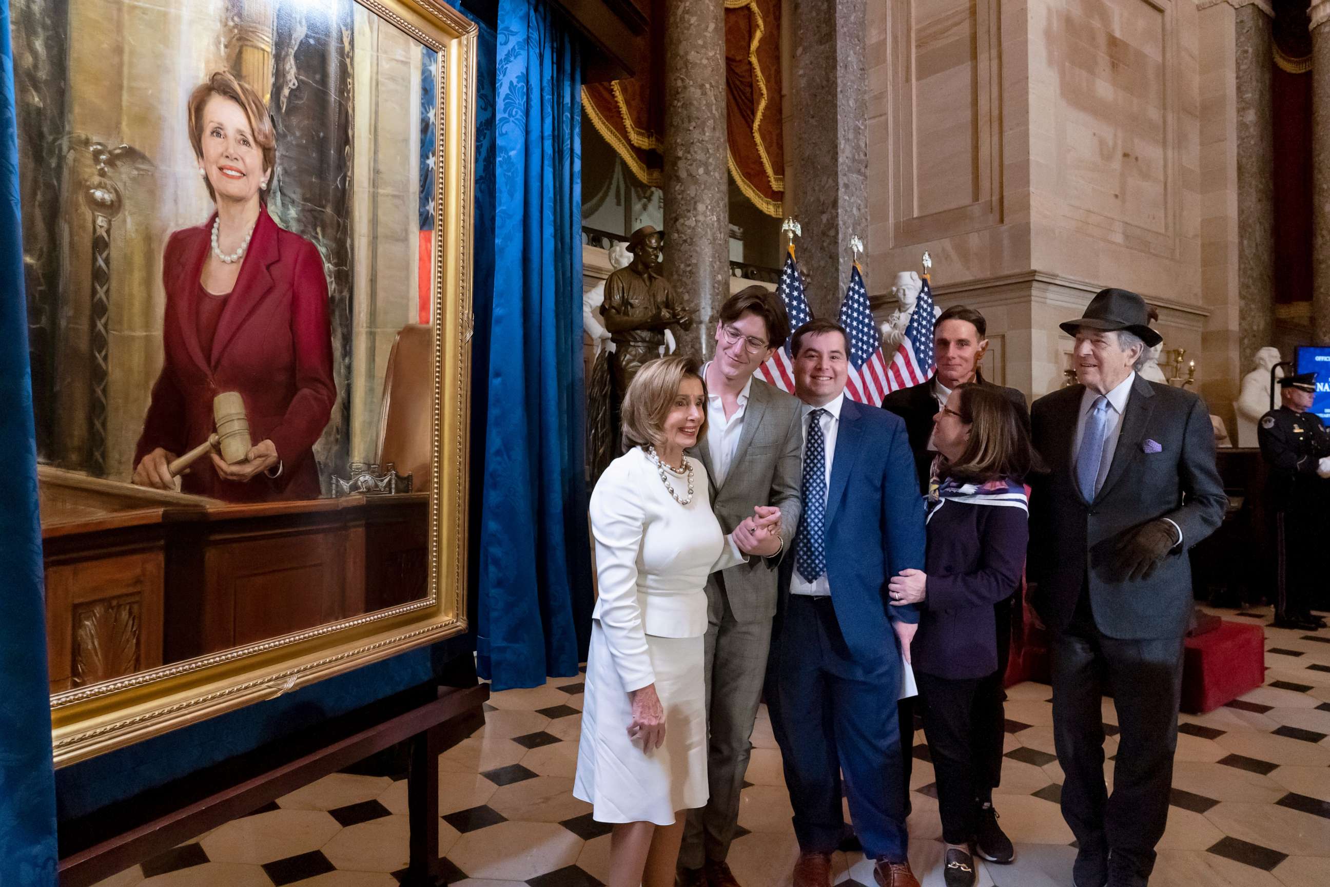 PHOTO: Speaker of the House Nancy Pelosi, D-Calif., is joined by her family and husband Paul Pelosi, far right, as they attend her portrait unveiling ceremony in Statuary Hall at the Capitol in Washington, Dec. 14, 2022.