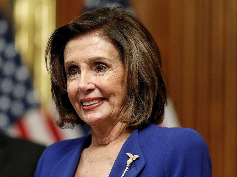 PHOTO: House Speaker Nancy Pelosi hosts a signing ceremony after the House of Representatives approved a $2.2 trillion coronavirus aid package at the U.S. Capitol, in Washington, March 27, 2020. 