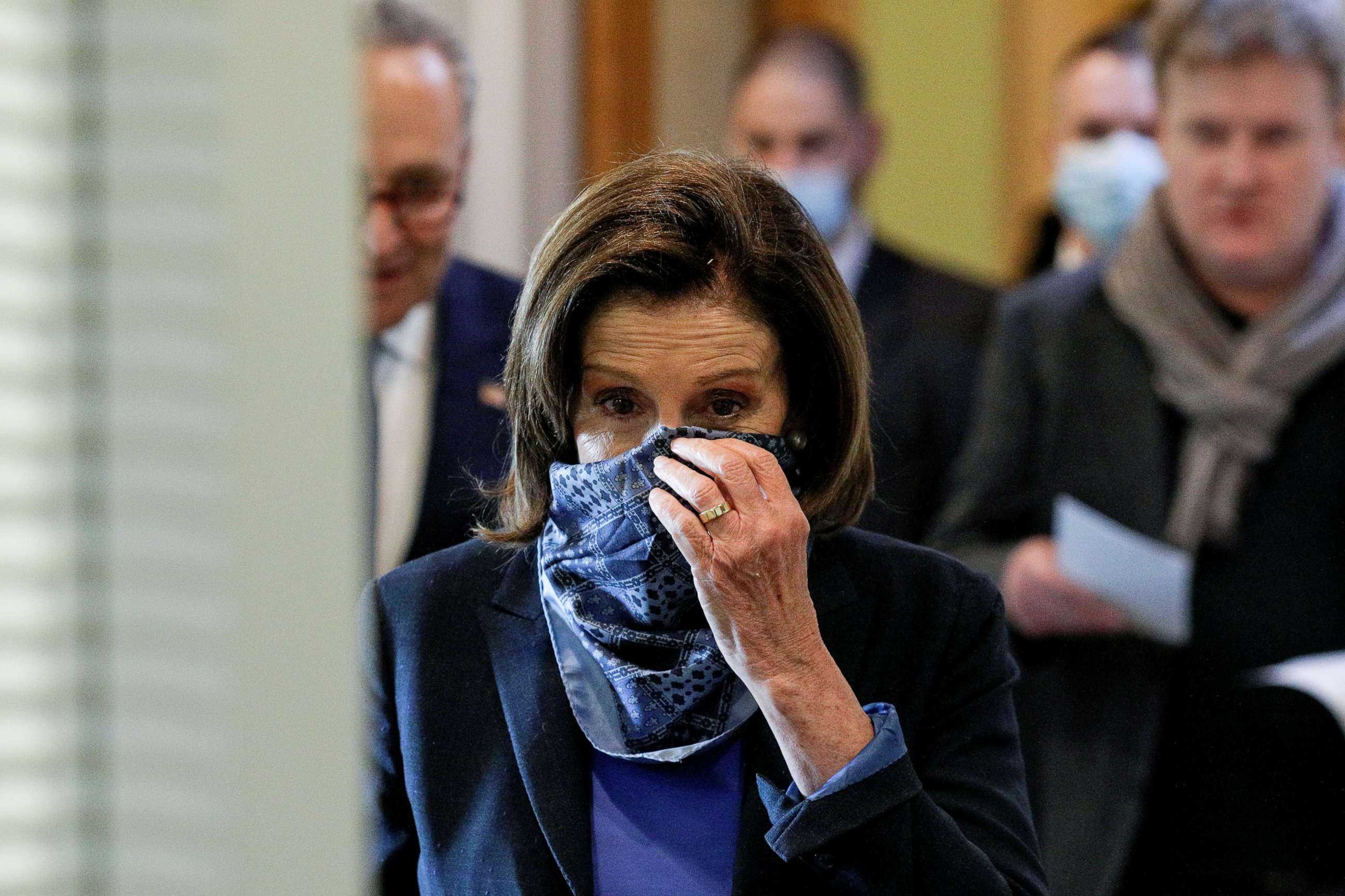 PHOTO: Speaker of the House Nancy Pelosi adjusts her face mask as she arrives inside the U.S. Capitol in Washington, April 21, 2020.