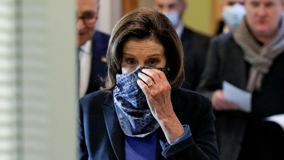 PHOTO: Speaker of the House Nancy Pelosi adjusts her face mask as she arrives inside the U.S. Capitol in Washington, April 21, 2020.