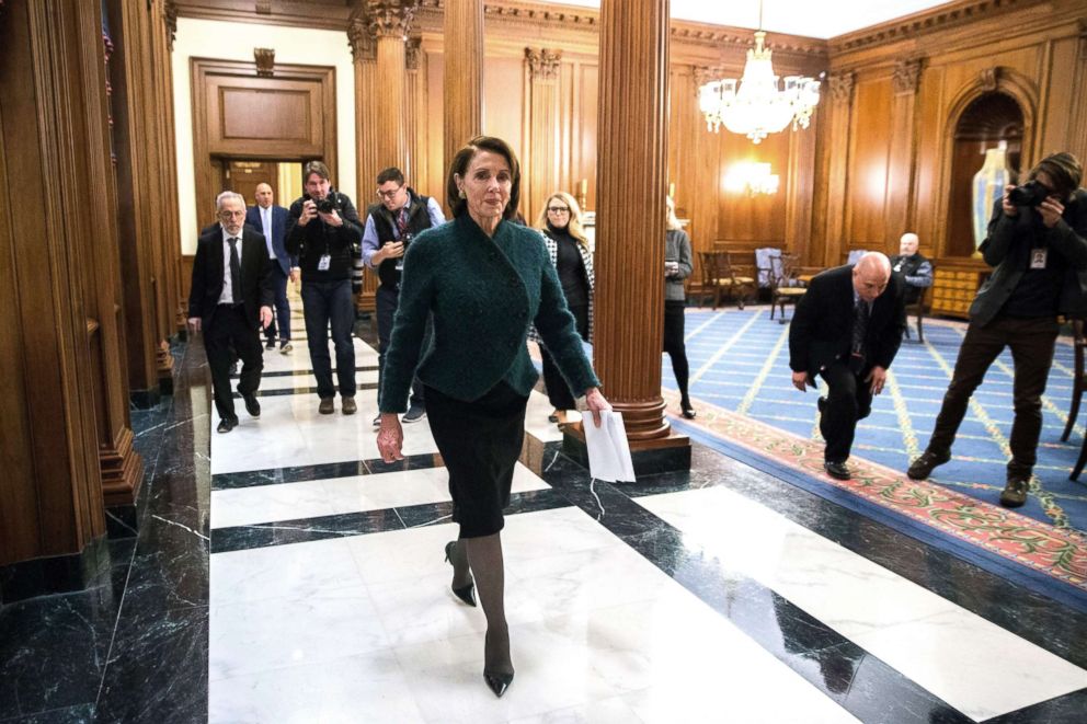 PHOTO: Nancy Pelosi walks to her office after the House voted to halt the government shutdown and approve the budget package, Feb. 9, 2018. 