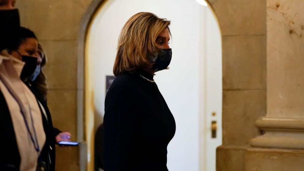 PHOTO: Speaker of the House Nancy Pelosi walks to her office after the U.S. House voted to impeach President Donald Trump in Washington, Jan. 13, 2021.