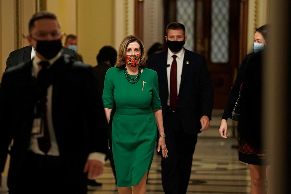 PHOTO: Speaker of the House Nancy Pelosi, D-Calif., walks from the Senate floor as both chambers of Congress are aimed to pass the COVID-19 package in a marathon session on Capitol Hill, Dec. 21, 2020.