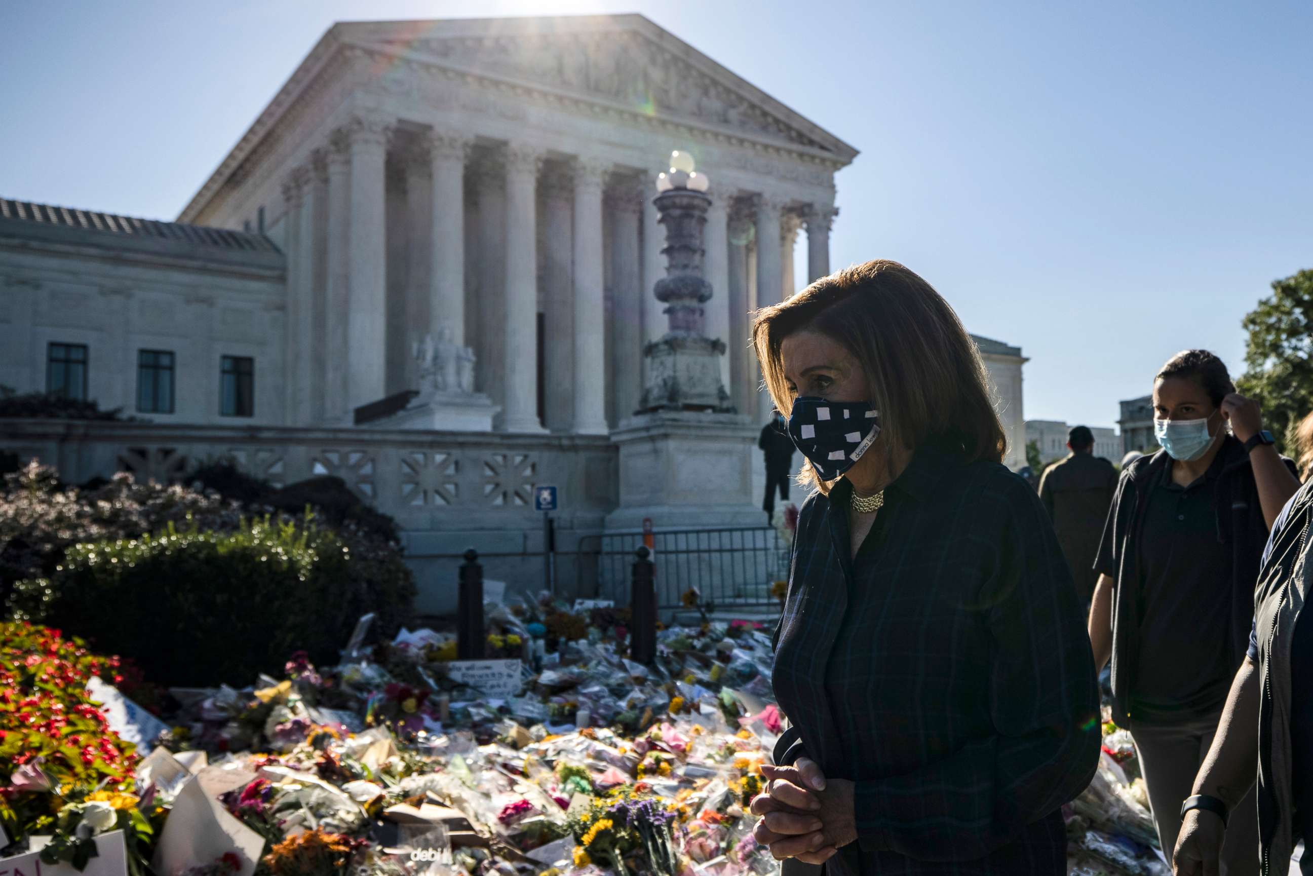 PHOTO: Speaker of the House Nancy Pelosi arrives to pay her respects at the makeshift memorial for Justice Ruth Bader Ginsburg in front of the US Supreme Court, Sept. 20, 2020 in Washington.
