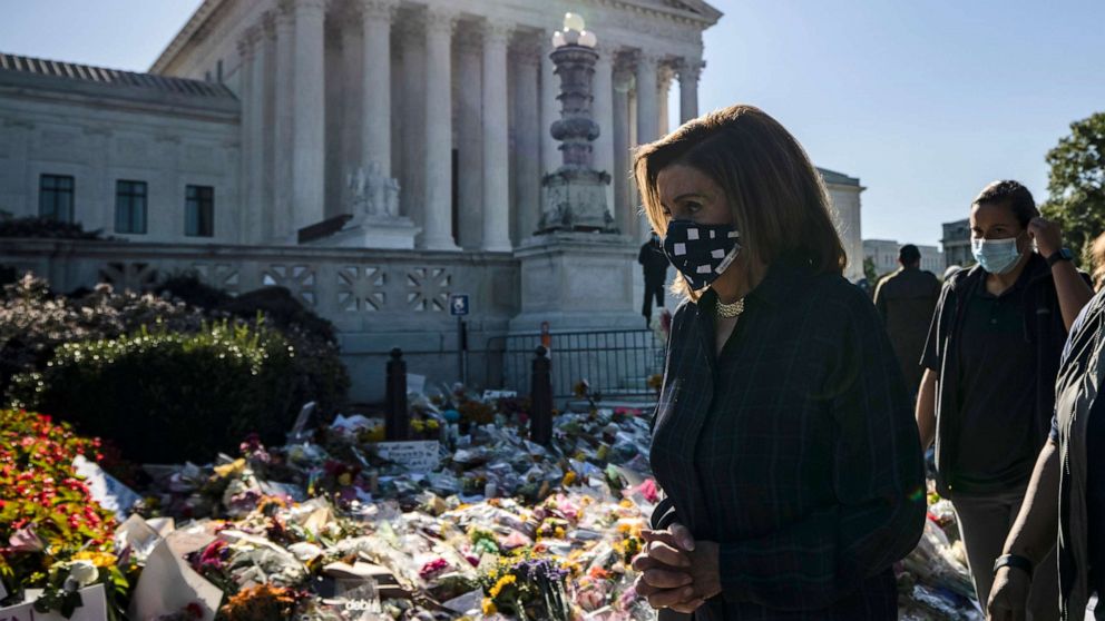 PHOTO: Speaker of the House Nancy Pelosi arrives to pay her respects at the makeshift memorial for Justice Ruth Bader Ginsburg in front of the US Supreme Court, Sept. 20, 2020 in Washington.