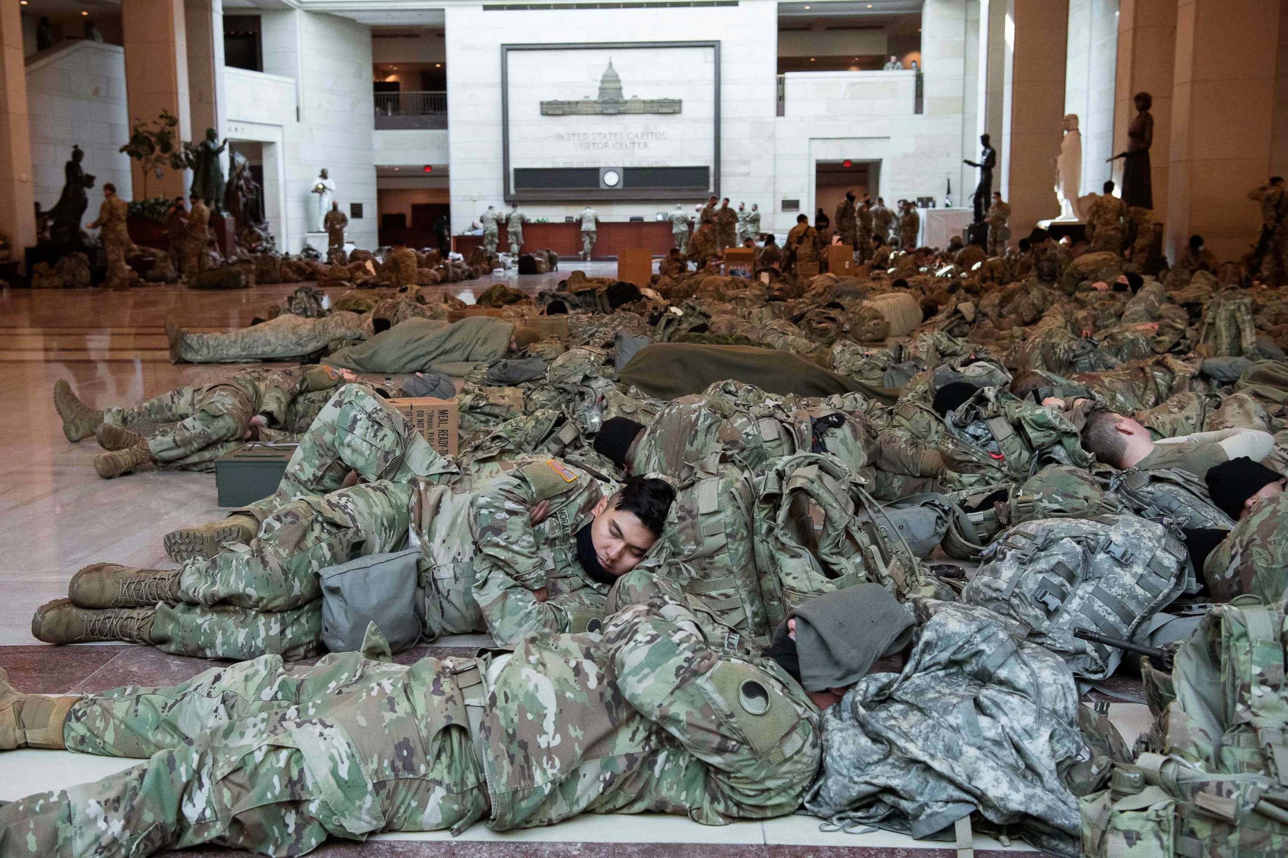 PHOTO: Members of the National Guard rest in the Capitol Visitors Center, Jan. 13, 2021, in Washington, D.C., ahead of an expected House vote on impeaching President Donald Trump for a second time.