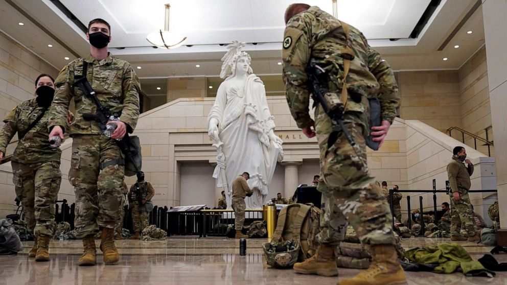 PHOTO: National Guard members assembly in the Capitol Visitor's Center on Capitol Hill before Democrats begin debating one article of impeachment against President Donald Trump at the U.S. Capitol, Jan. 13, 2021.