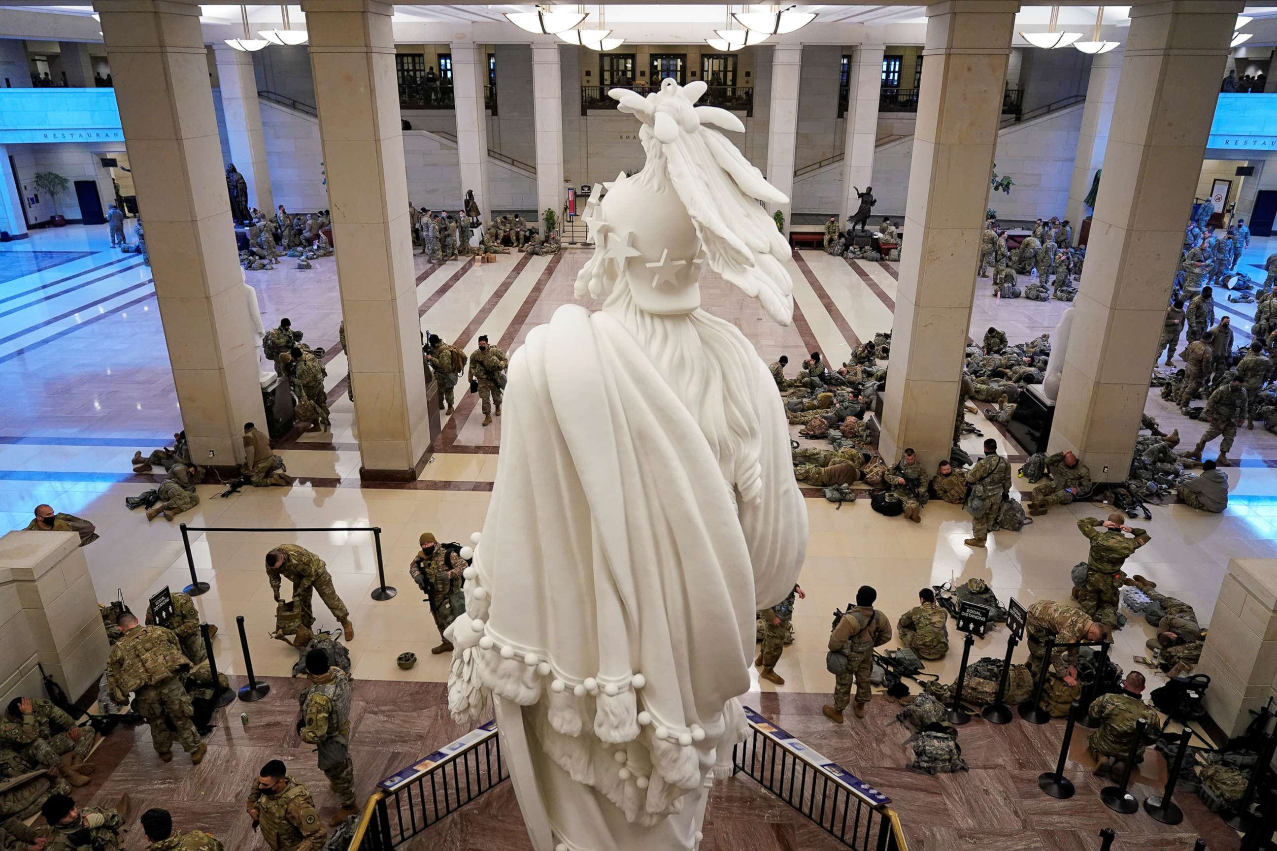 PHOTO: National Guard members assembly in the Capitol Visitor's Center on Capitol Hill before Democrats begin debating one article of impeachment against President Donald Trump at the U.S. Capitol, Jan. 13, 2021.