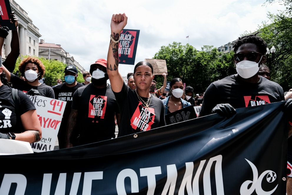 PHOTO: Natasha Cloud marches to the MLK Memorial to support Black Lives Matter and marking the end of slavery in the U.S., June 19, 2020, in Washington.