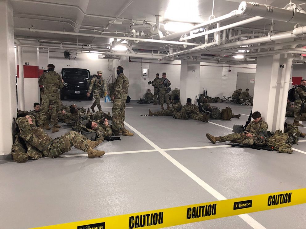 PHOTO: Photos like this one, showing the National Guardsmen resting in a parking garage, after they were ordered to leave the Capitol building following the inauguration on Jan. 20, 2021, sparked outrage among lawmakers.