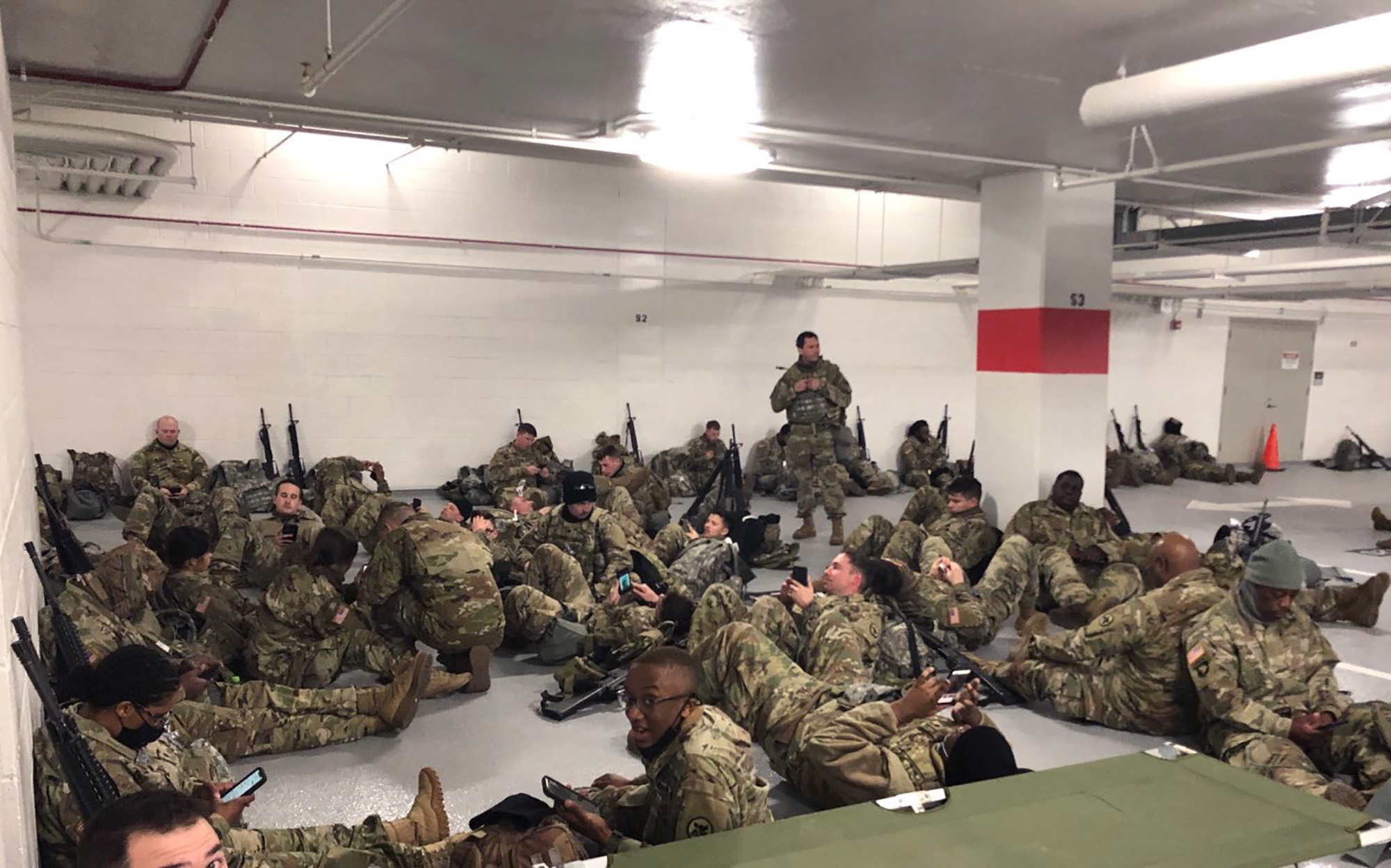 PHOTO: Photos like this one, showing the National Guardsmen resting in a parking garage, after they were ordered to leave the Capitol building following the inauguration on Jan. 20, 2021, sparked outrage among lawmakers.