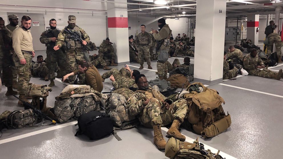 PHOTO: Photos like this one, showing the National Guardsmen resting in a parking garage, after they were ordered to leave the Capitol building following the inauguration on Jan. 20, 2021, sparked outrage among lawmakers.