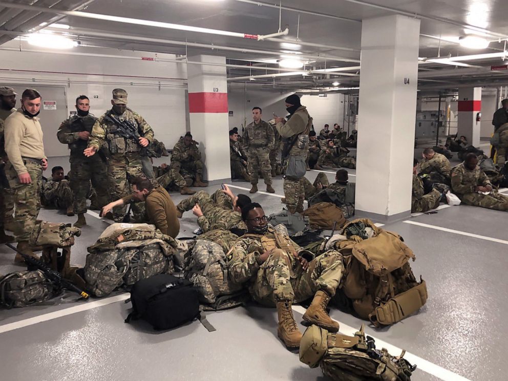 PHOTO: Photos like this one, showing the National Guardsmen resting in a parking garage, after they were ordered to leave the Capitol building following the inauguration on Jan. 20, 2021, sparked outrage among lawmakers.