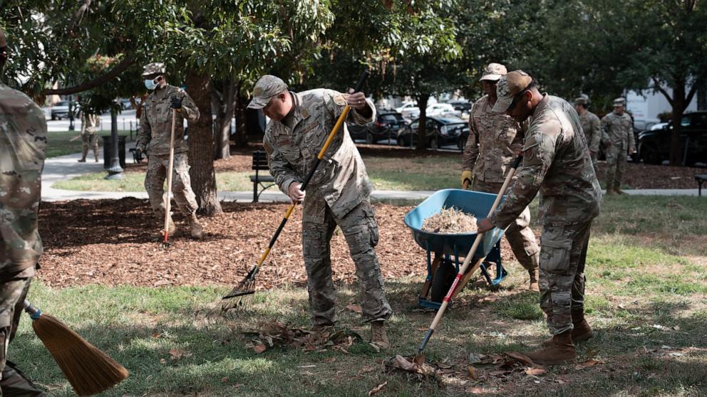 PHOTO: Air National Guard airmen work clearing leaves and debris from McPherson Square Park on August 28, 2025 in Washington, DC.