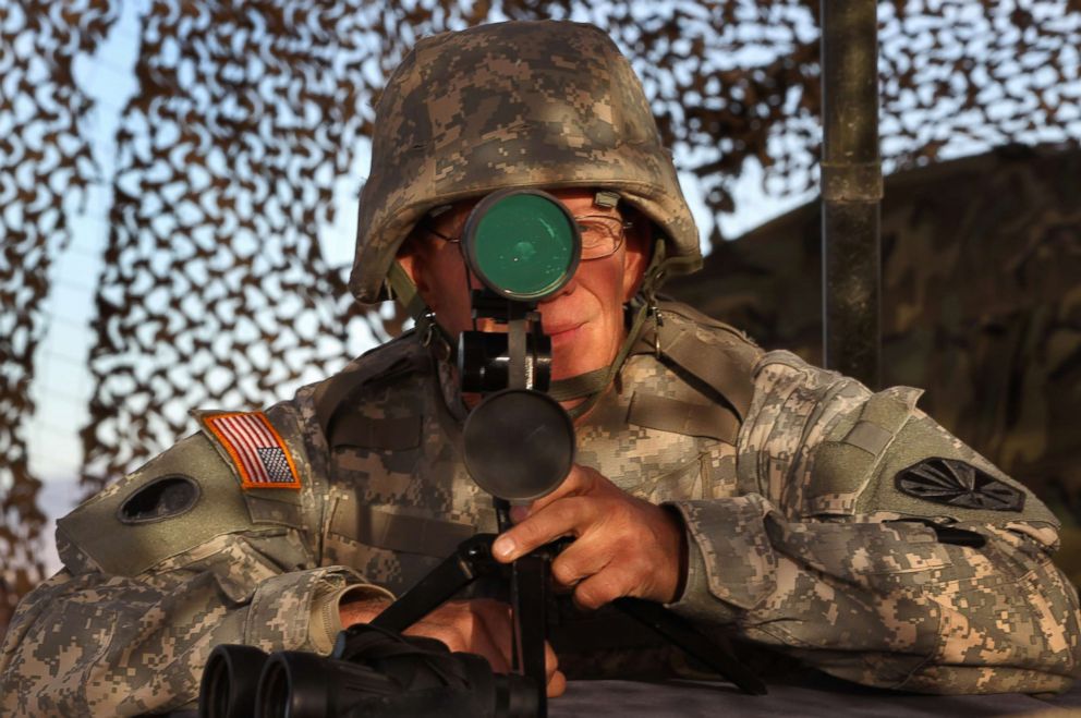 PHOTO: An Arizona National Guardsman watches over the U.S. border with Mexico at an observation post, Dec. 7, 2010, in Nogales, Ariz.