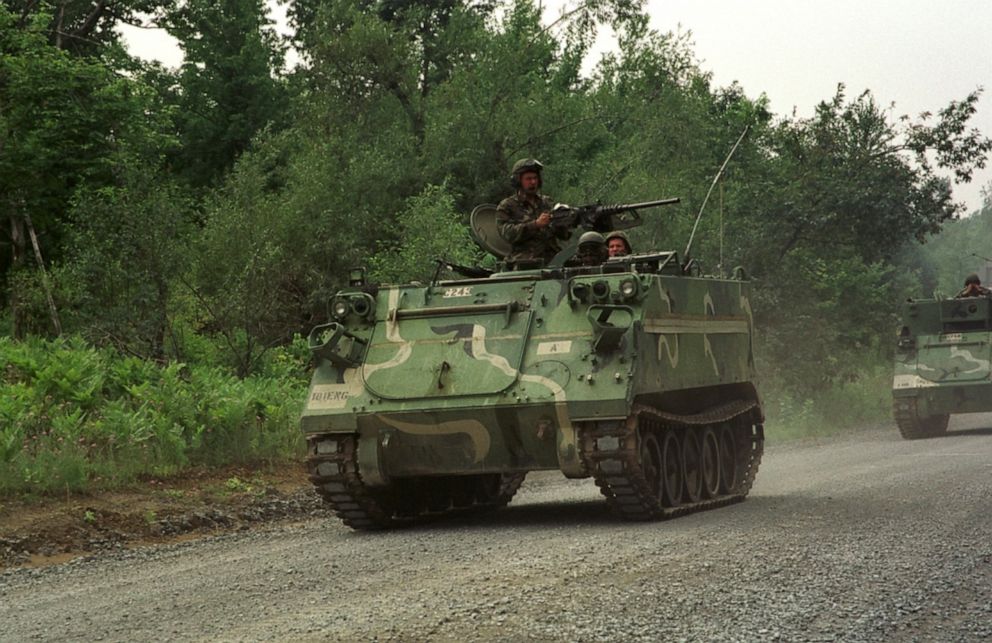 PHOTO: M113 armored personnel carriers with the New Jersey Army National Guard, travel on a road at Fort Drum, N.Y., June 8, 2000. 