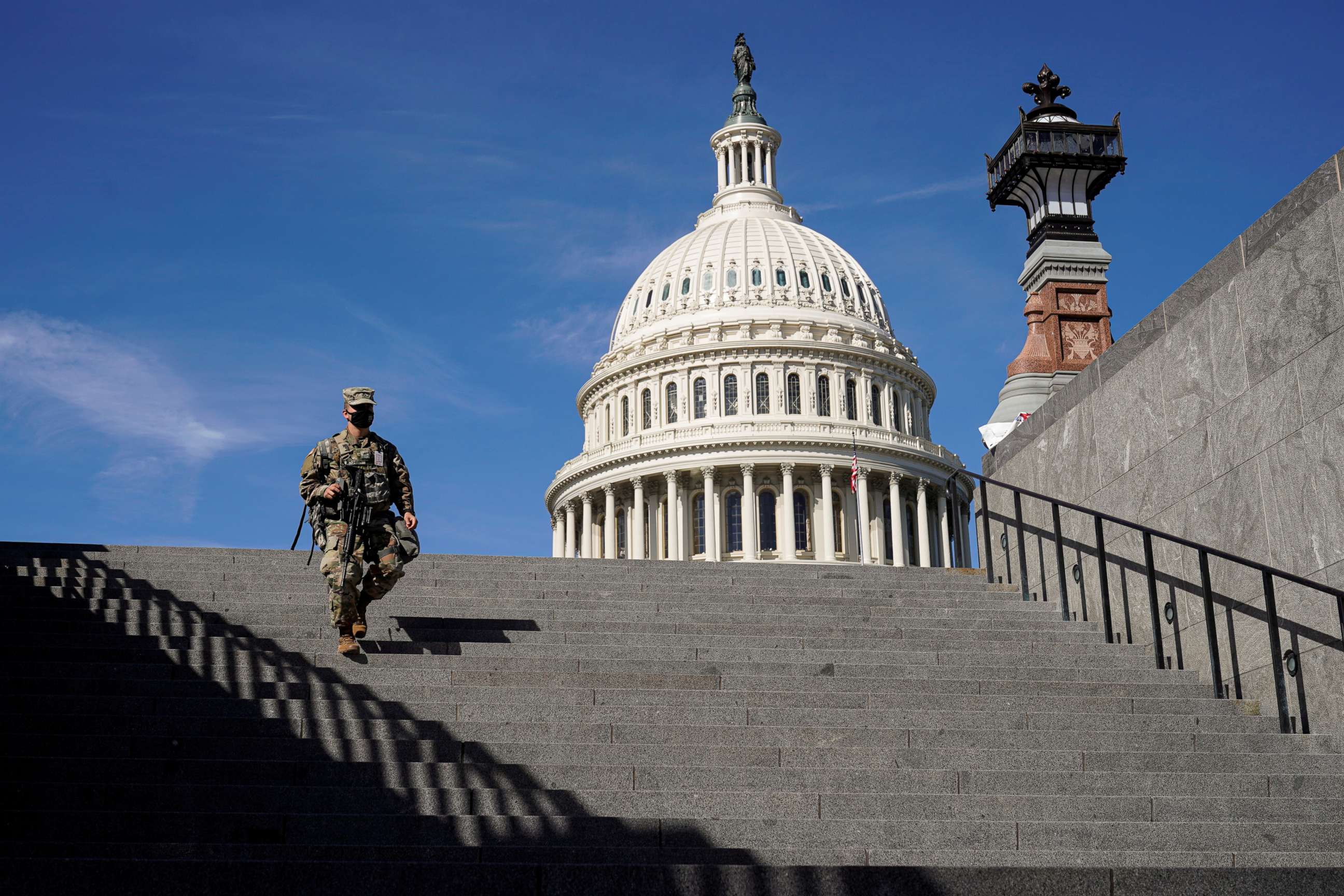 PHOTO: A member of the National Guard walks on Capitol Hill in Washington on March 8, 2021.