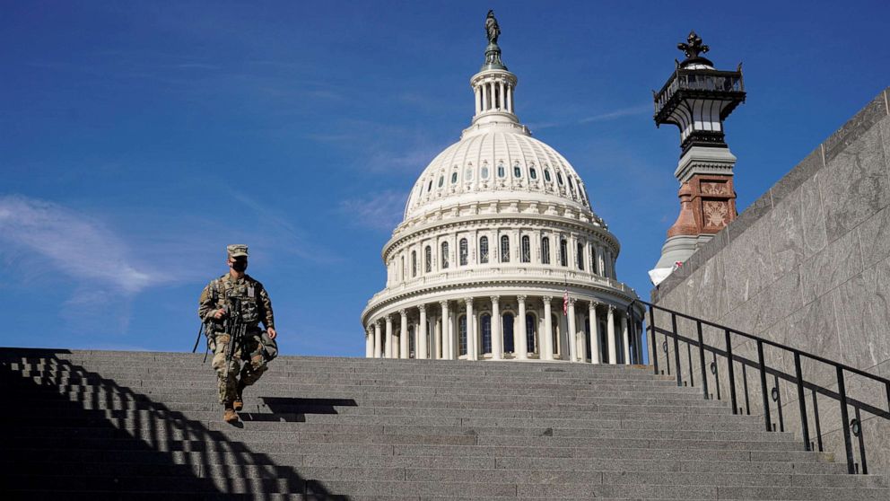 PHOTO: A member of the National Guard walks on Capitol Hill in Washington on March 8, 2021.