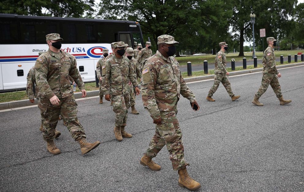 PHOTO: National Guard troops arrive at the Armory after ending their mission of providing security to the U.S. Capitol, May 24, 2021, in Washington, DC.