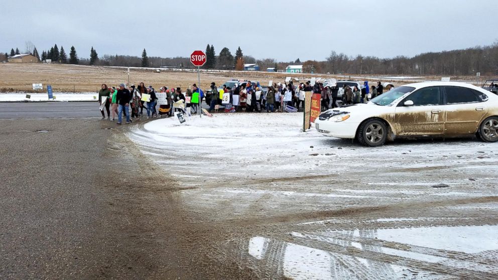 PHOTO: A group of youth activists march to a polling place on the Turtle Mountain Indian Reservation in Belcourt, N.D., Nov. 6, 2018.