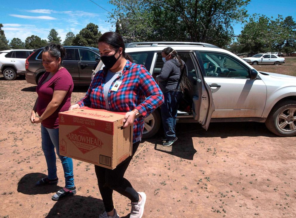 PHOTO: Water is delivered by staff of the John Hopkins Center for American Indian Health at a home with no running water, near the Navajo Nation town of Fort Defiance in Arizona, May 22, 2020. 
