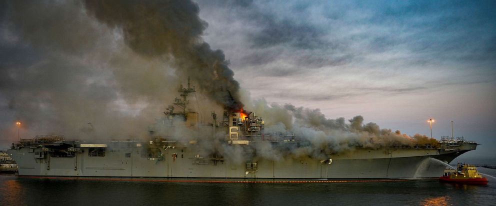 PHOTO: Boats combat a fire on board the U.S. Navy amphibious assault ship USS Bonhomme Richard at Naval Base San Diego, July 12, 2020.
