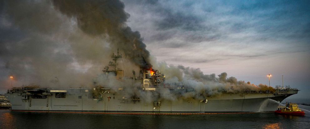 PHOTO: In this July 12, 2020, file photo, boats combat a fire on board the U.S. Navy amphibious assault ship USS Bonhomme Richard at Naval Base San Diego.