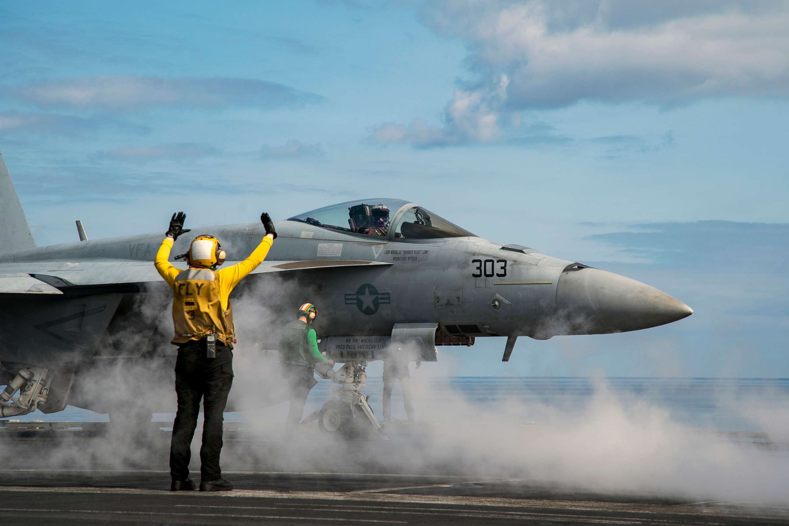 PHOTO: A U.S. Navy pilot sits in a Boeing EA-18G Growler electronic warfare aircraft on the deck of the USS Harry S. Truman carrier cruising in the Mediterranean Sea, March 17, 2022.