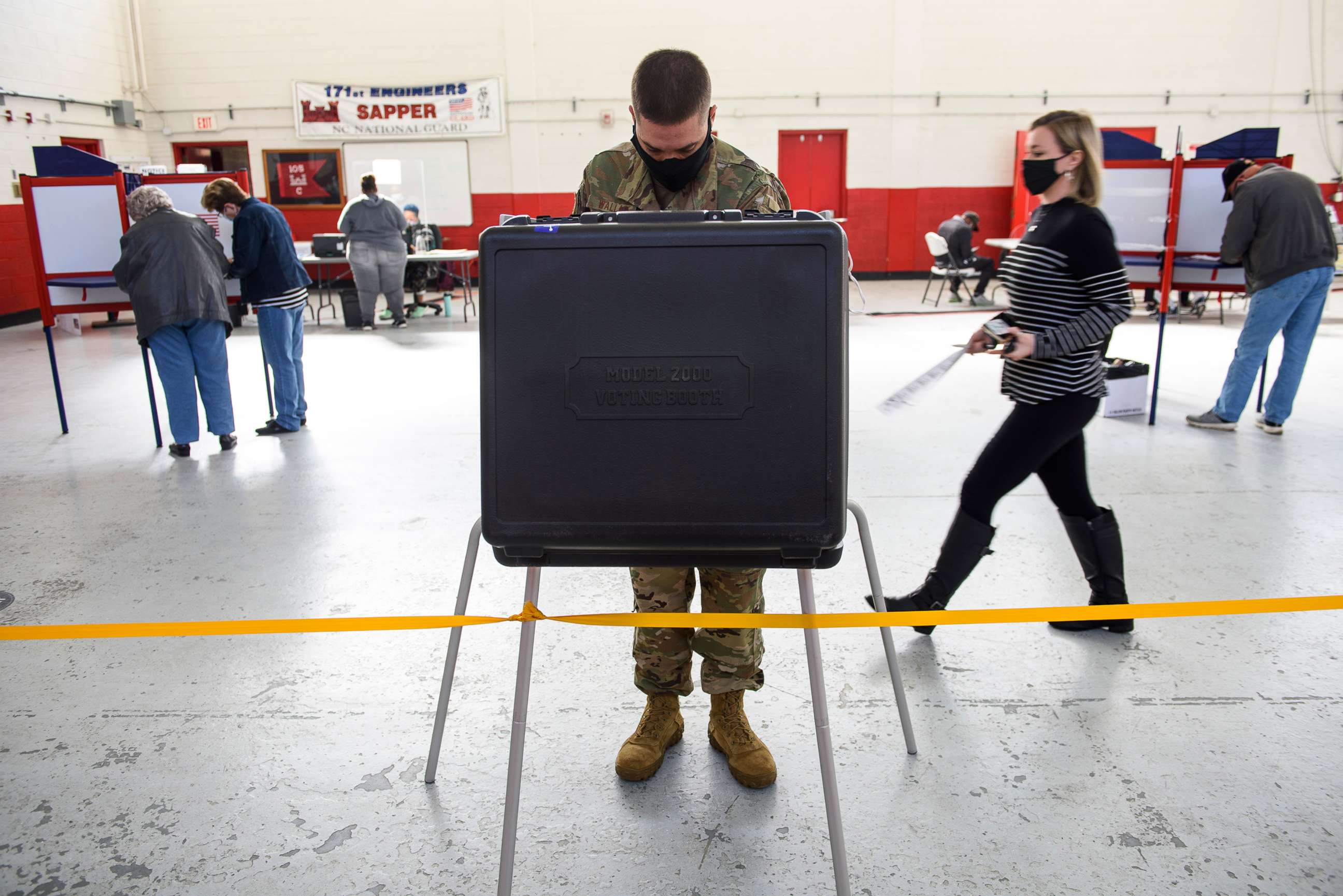 PHOTO: Mst. Sgt. Sam Wallace fills out a ballot on Election Day on Nov. 3, 2020 in St. Pauls, North Carolina.