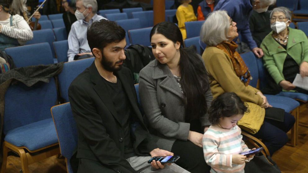 PHOTO: Negin Khpolwak, her husband, Hamid, and 2-year-old daughter attend a charity concert for Afghan refugees at an Episcopal church on Capitol Hill in Washington, D.C.