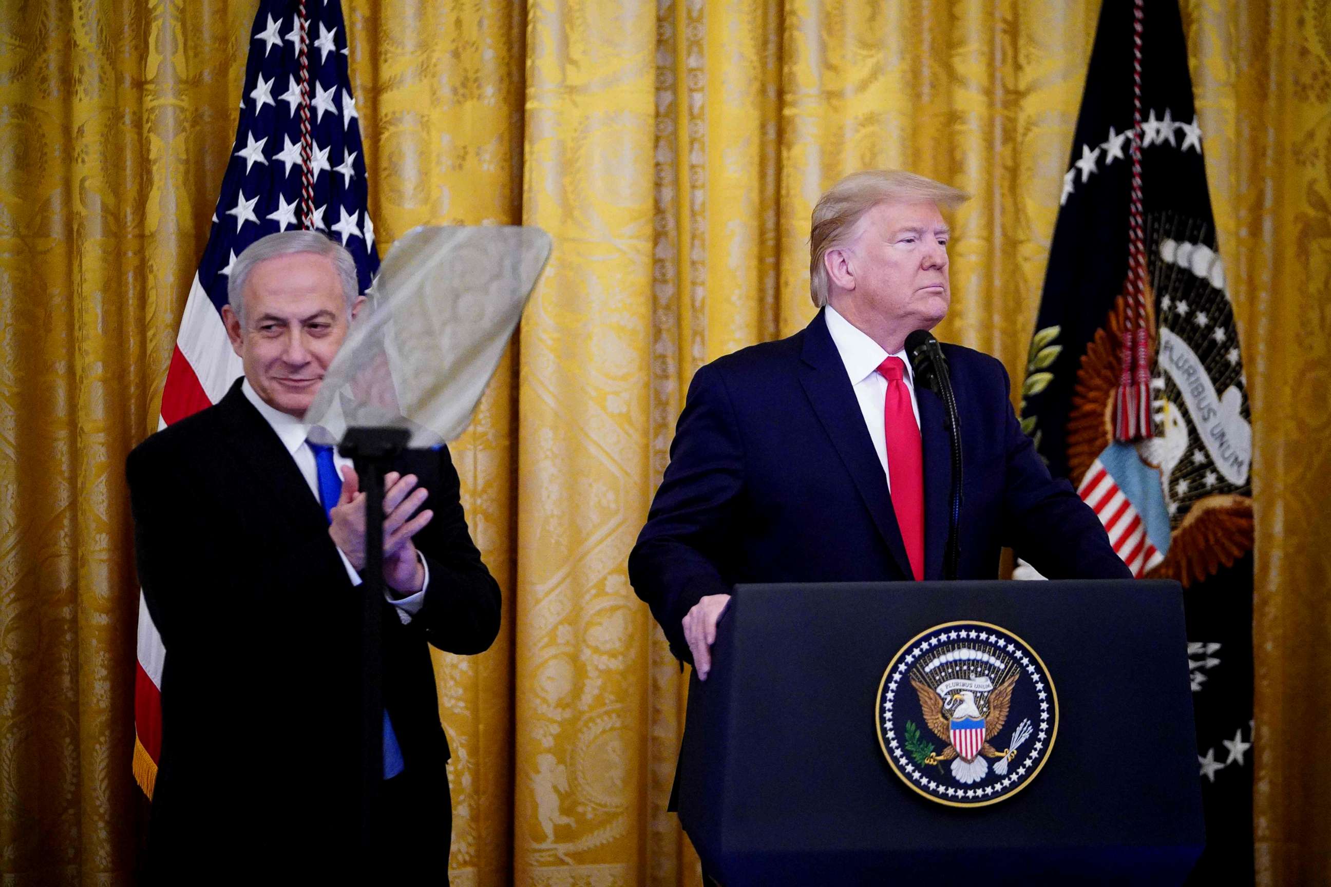 PHOTO: Israel's Prime Minister Benjamin Netanyahu and President Donald Trump take part in an announcement of Trump's Middle East peace plan in the East Room of the White House in Washington, D.C. on Jan. 28, 2020.