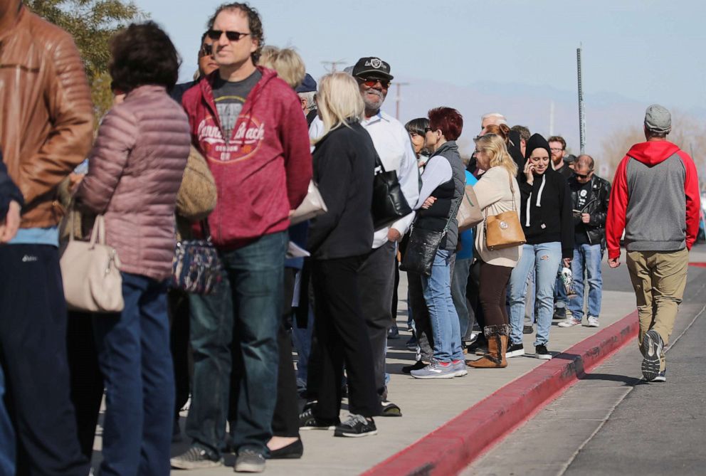 PHOTO: People wait in line to vote on the final day of early voting for the upcoming Nevada Democratic presidential caucus, Feb. 18, 2020, in Henderson, Nevada.