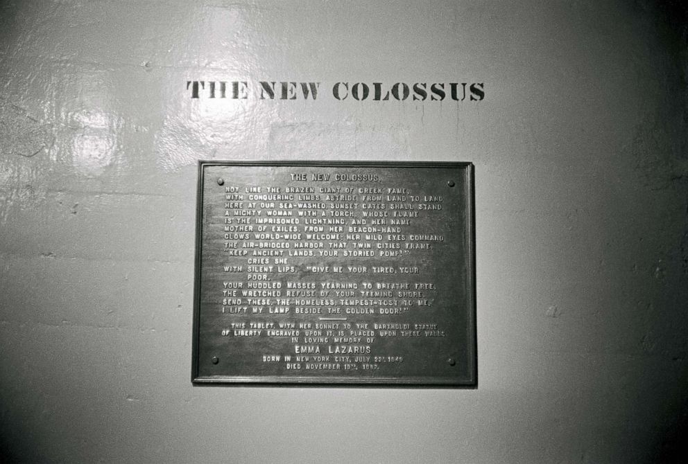 PHOTO: Poem entitled The New Colossus by Emma Lazarus located on the base of the Statue of Liberty.