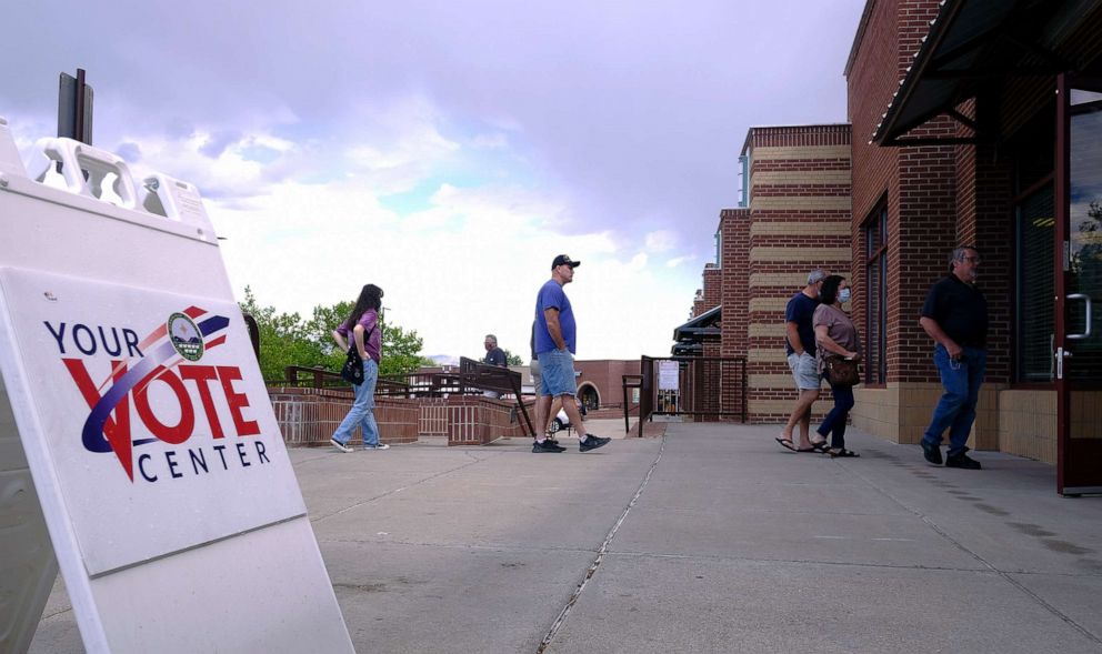 PHOTO: Voters wait in line at  Petroglyph Plaza to cast their ballots in the CD1 Special Election to replace former Rep. Deb Haaland who resigned her seat after being confirmed as Secretary of the Interior, June  1, 2021, Albuquerque, N.M.