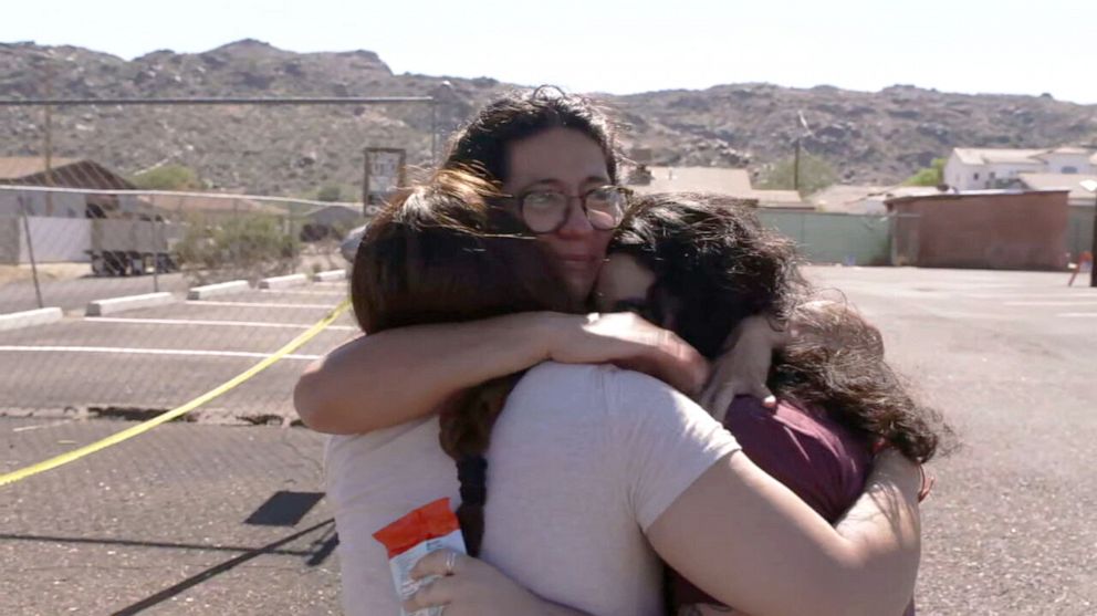 PHOTO: Yesenia Cruz-Bejarano of Phoenix, Ariz., embraces her daughters after casting her first vote as a U.S. citizen.