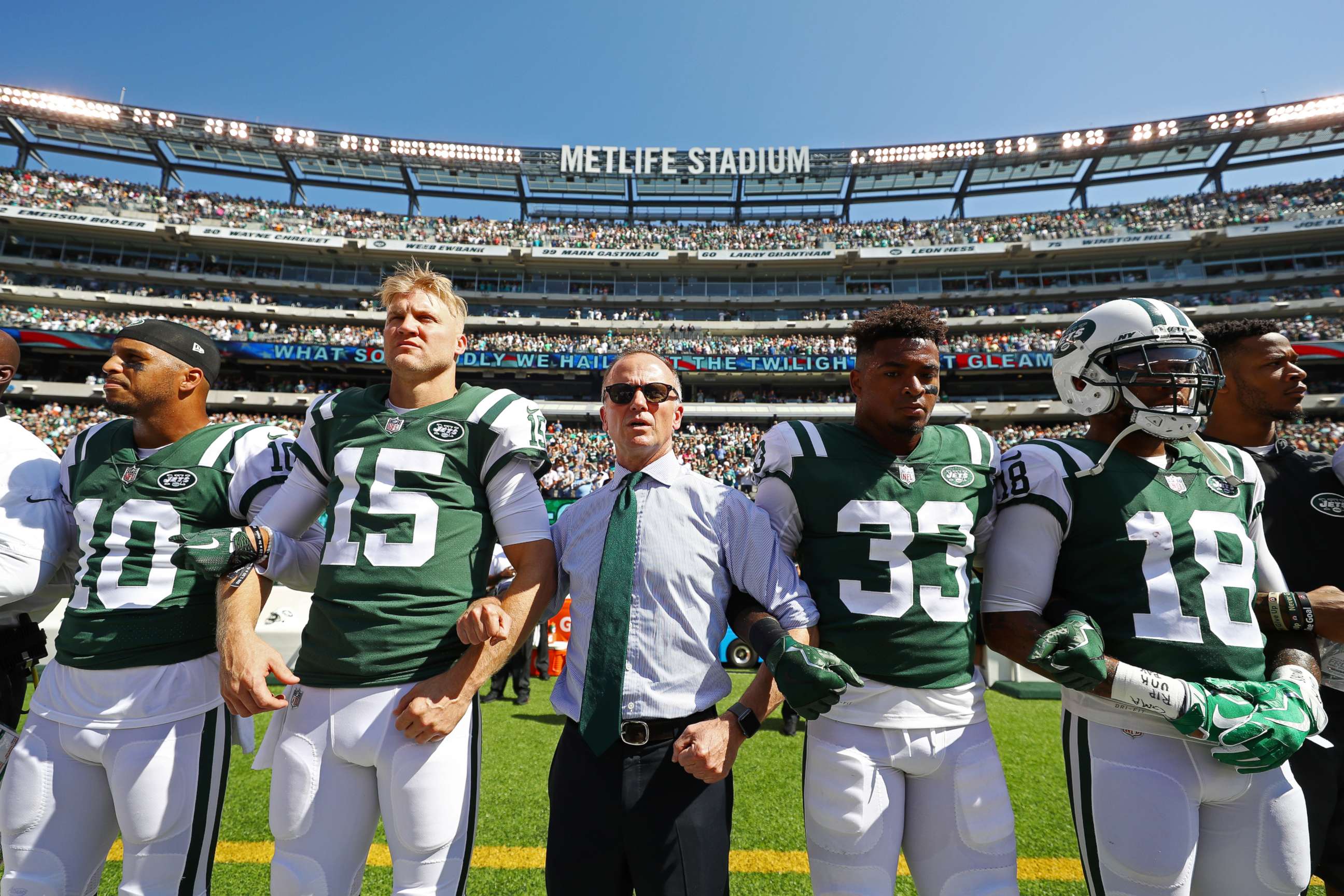 PHOTO: Jermaine Kearse #10, Josh McCown #15, Jamal Adams #33, ArDarius Stewart #18 and Christopher Johnson CEO of the New York Jets stand in unison with his team during the National Anthem prior to an NFL game, Sept. 24, 2017 in East Rutherford, N.J.  