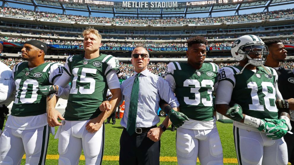 PHOTO: Jermaine Kearse #10, Josh McCown #15, Jamal Adams #33, ArDarius Stewart #18 and Christopher Johnson CEO of the New York Jets stand in unison with his team during the National Anthem prior to an NFL game, Sept. 24, 2017 in East Rutherford, N.J.  