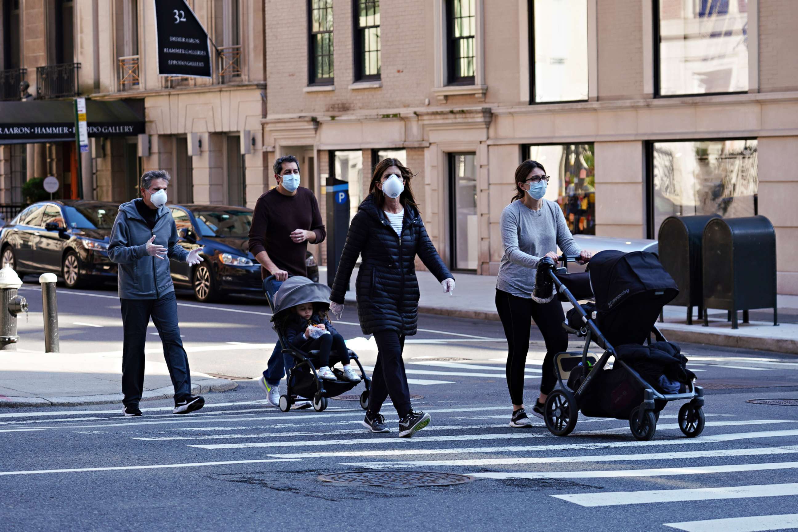 PHOTO: People are seen wearing protective masks and gloves during the coronavirus pandemic on April 12, 2020, in New York.