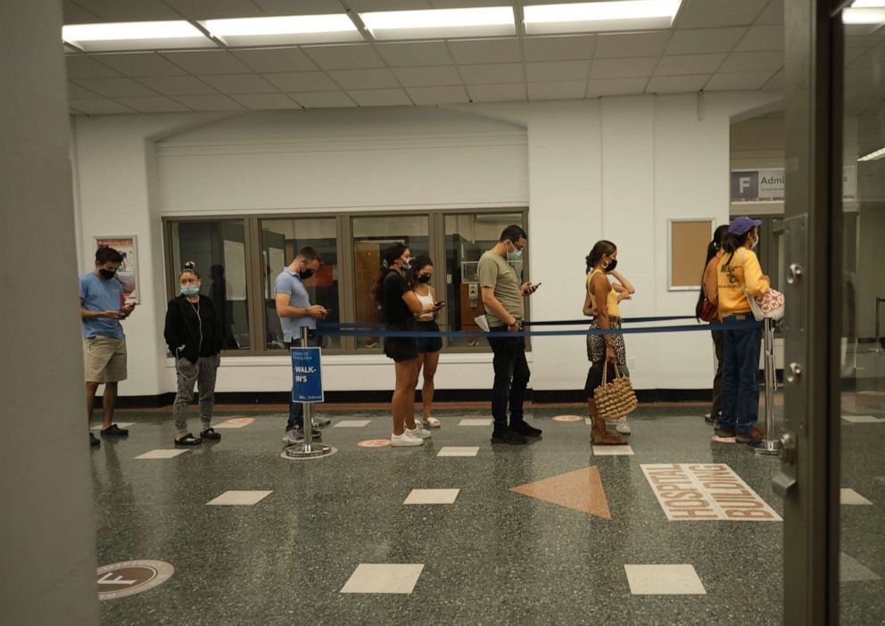 PHOTO: Bellevue Hospital employees wait on line to receive vaccine on the first day of the NYC Health and Hospitals COVID-19 vaccination mandate for all public hospital employees, in New York, Aug. 2, 2021.