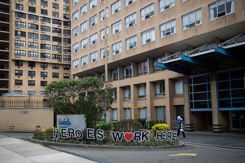 PHOTO: In this May 3, 2020, file photo, a man passes by the Isabella Geriatric Center in New York.