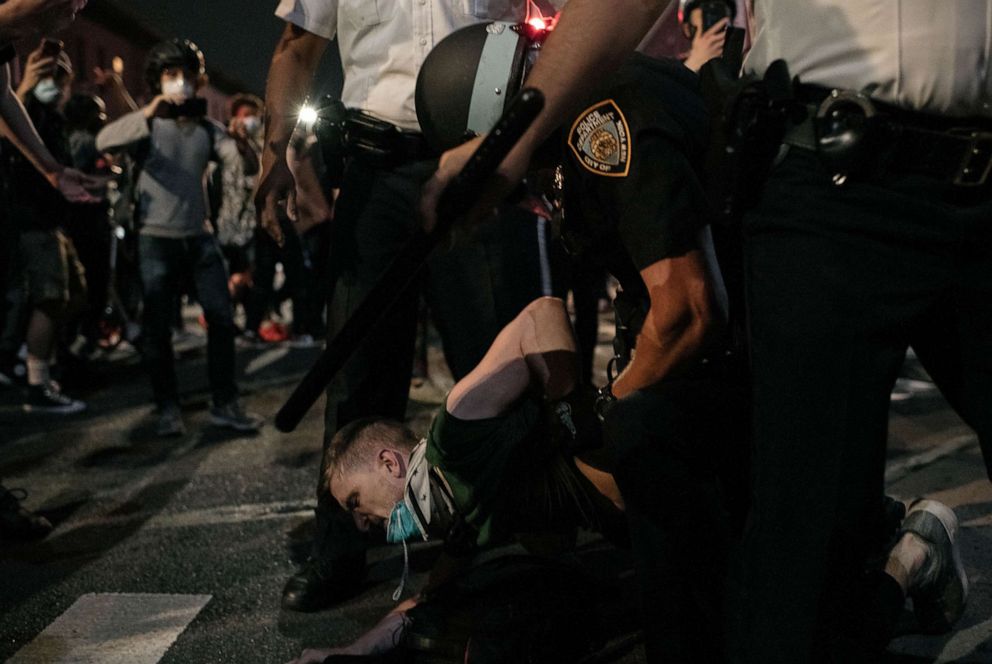 PHOTO: An NYPD officer wrestles a protester to the ground during a march denouncing systemic racism in law enforcement that violated a citywide curfew on June 4, 2020, in New York.