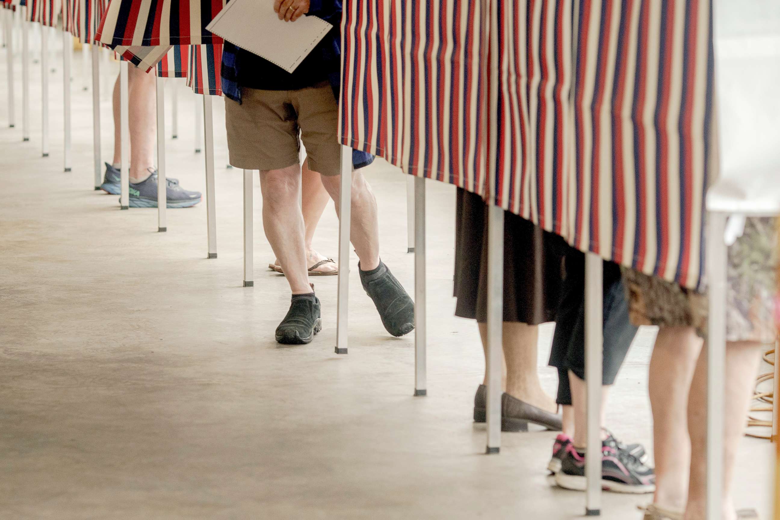 PHOTO: Voters cast their ballots in the state's primary elections at a polling location in Littleton, N.H., Sept. 13, 2022. 