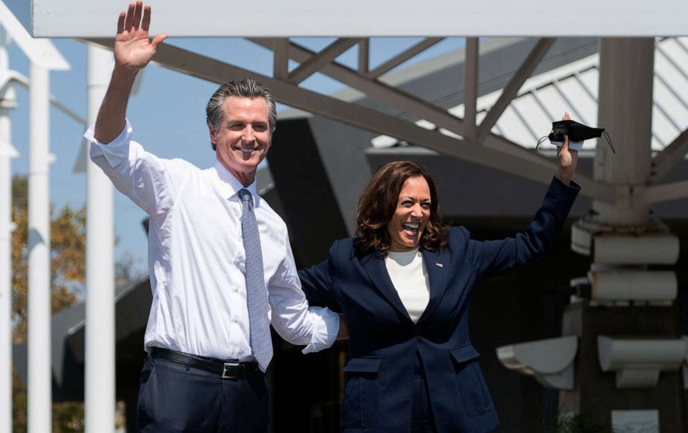 PHOTO: Vice President Kamala Harris waves alongside California Governor Gavin Newsom during a campaign event against his recall election at the IBEW-NECA Joint Apprenticeship Training Center in San Leandro, Calif., Sept. 8, 2021.