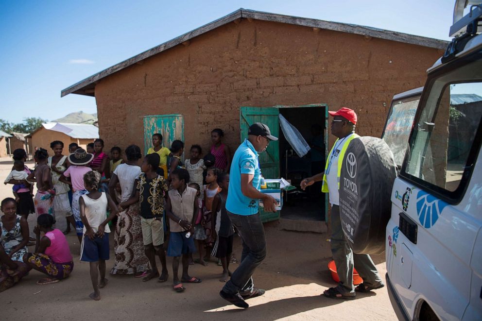 PHOTO: Dr. Jean Rangomana carries supplies before opening the Marie Stopes International mobile clinic in Besakoa, Madagascar, April 9, 2018. He estimated that he would see at least 50 women seeking family planning during the clinic that day.