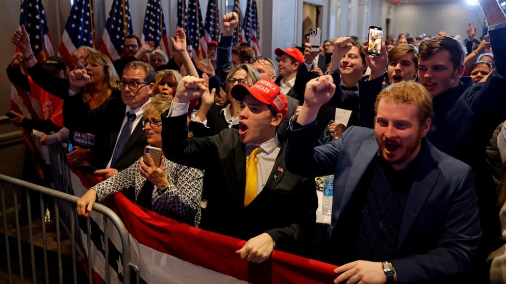 PHOTO: Supporters of Republican presidential candidate and former U.S. President Donald Trump cheer at his primary night party, Jan. 23, 2024, in Nashua, New Hampshire. 