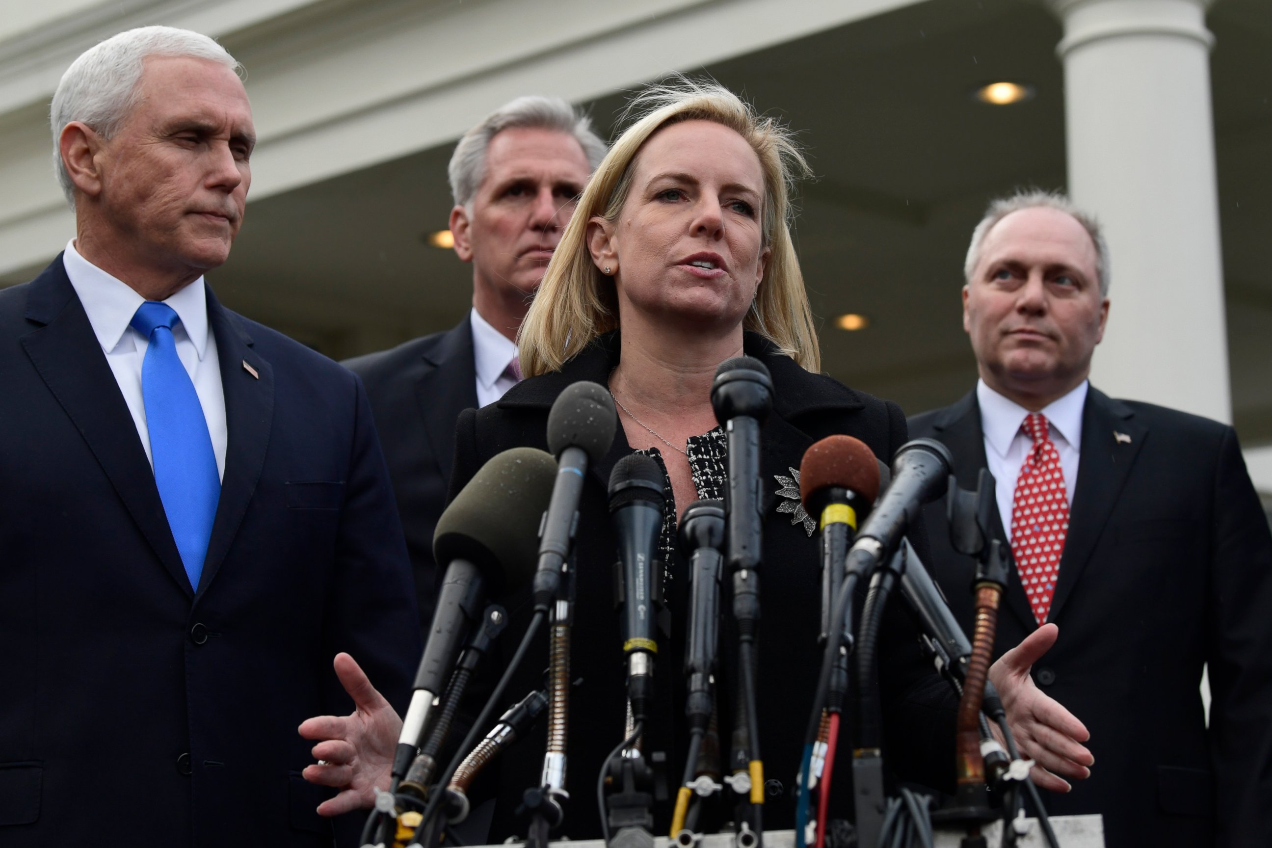PHOTO: In this Jan. 9, 2019, photo, Homeland Security Secretary Kirstjen Nielsen, second from right, standing with Vice President Mike Pence, speaks to reporters following a meeting at the White House in Washington.