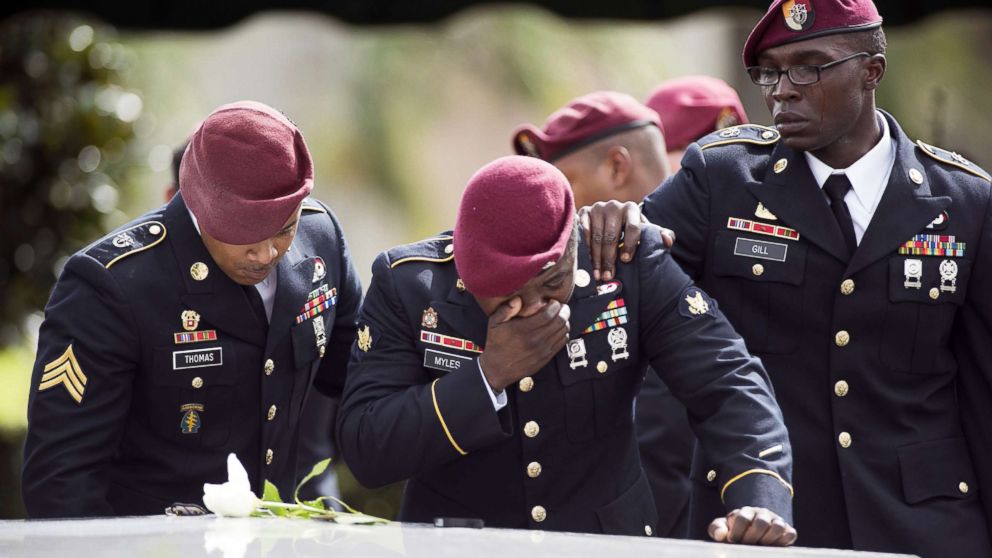 PHOTO: Members of the 3rd Special Forces Group, 2nd battalion, cry at the tomb of U.S. Army Sgt. La David Johnson at his burial service in the Memorial Gardens East cemetery on Oct. 21, 2017 in Hollywood, Fla. 
