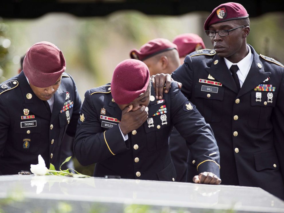 PHOTO: Members of the 3rd Special Forces Group, 2nd battalion, cry at the tomb of U.S. Army Sgt. La David Johnson at his burial service in the Memorial Gardens East cemetery on Oct. 21, 2017 in Hollywood, Fla.