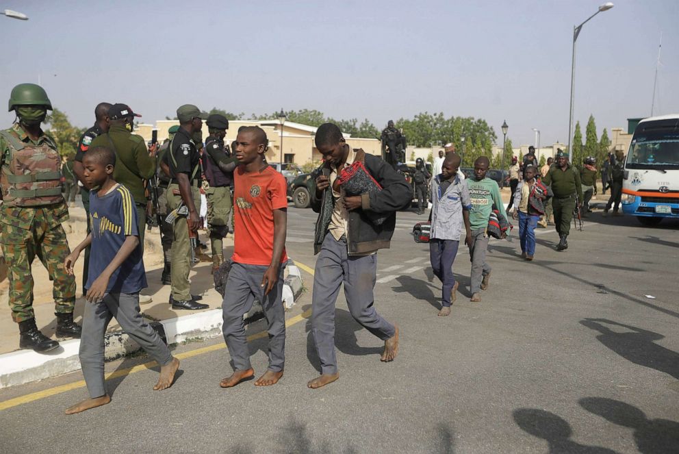 PHOTO: A group of schoolboys are escorted by Nigerian military and officials, Dec. 18, 2020, following their release after they were kidnapped last week in Katsina, Nigeria.