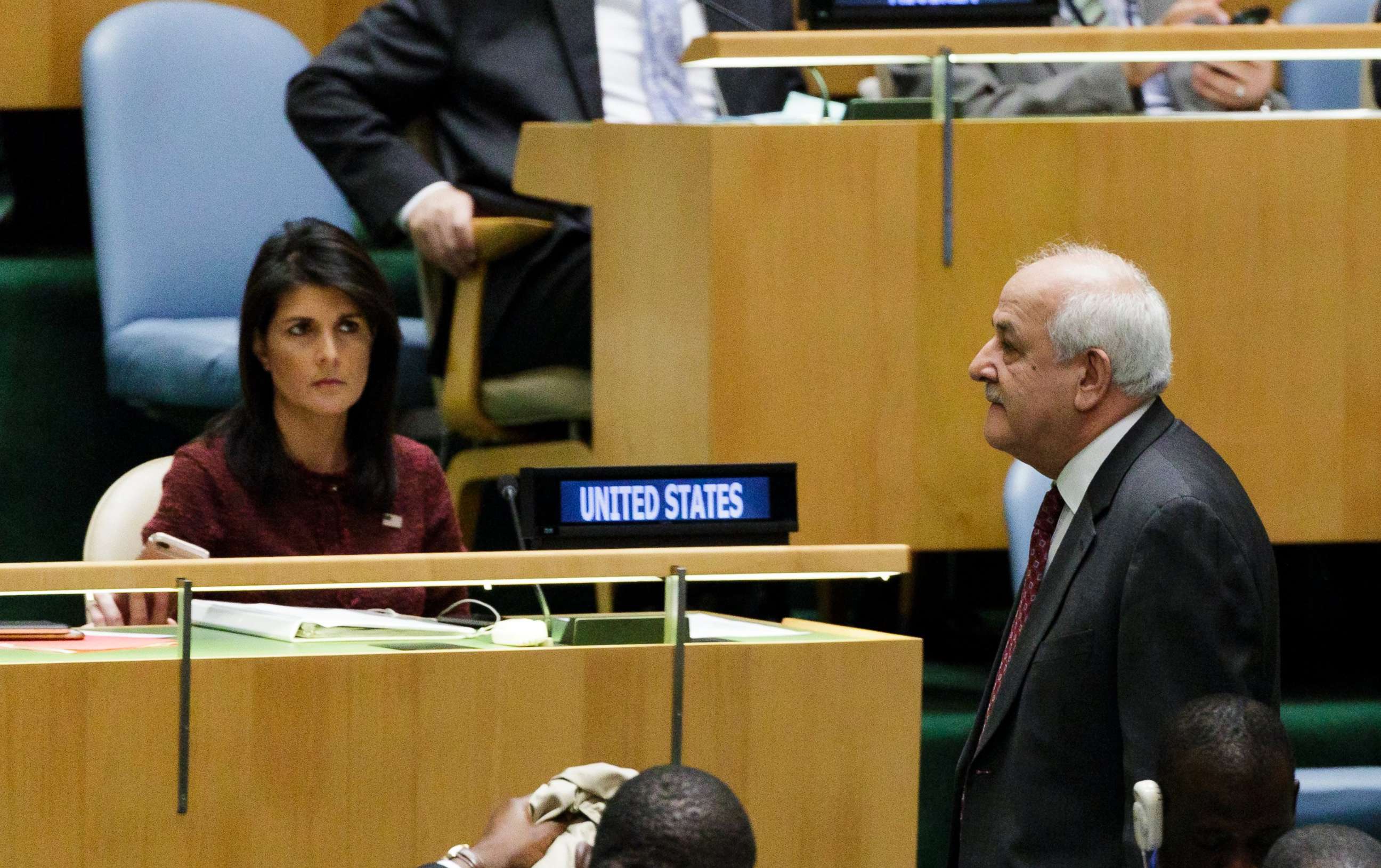 PHOTO: Riyad Mansour (R), Palestine's Permanent Observer to the United Nations, walks past U.S. Ambassador to the United Nations Nikki Haley (L), at the U.N. General Assembly, Dec. 21, 2017, at United Nations headquarters in New York.